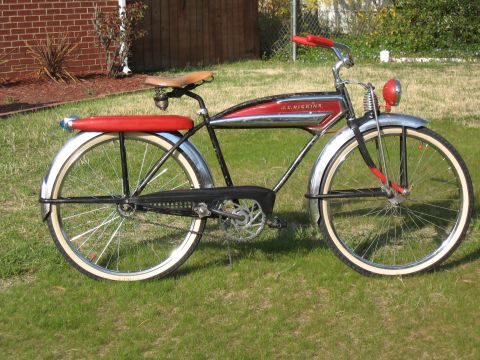 1994 Ford Bronco - Vintage J.C. Higgins bicycle parked on a grassy lawn with a brick wall in the background.