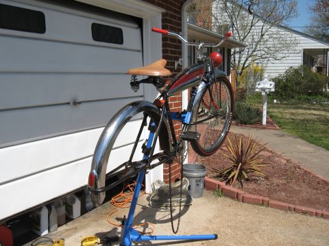 1994 Ford Bronco - Vintage bicycle undergoing maintenance on a repair stand outdoors.