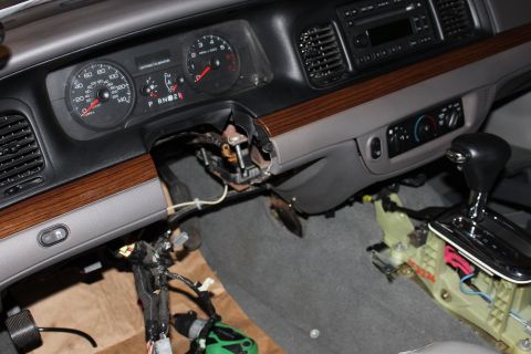 2007 Ford Crown Victoria - The interior of a 2007 Ford Crown Victoria is shown with the dashboard and center console partially disassembled.
