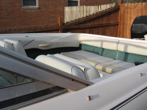 1994 Ford Bronco - View of a boat's interior, showing seating and a Mercury outboard motor in the background.