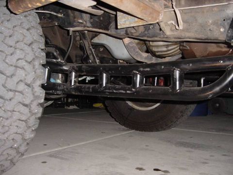 1987 Ford Bronco - This photo shows the underbody of a vehicle, focusing on the frame and aftermarket rock sliders, not a specific model year.