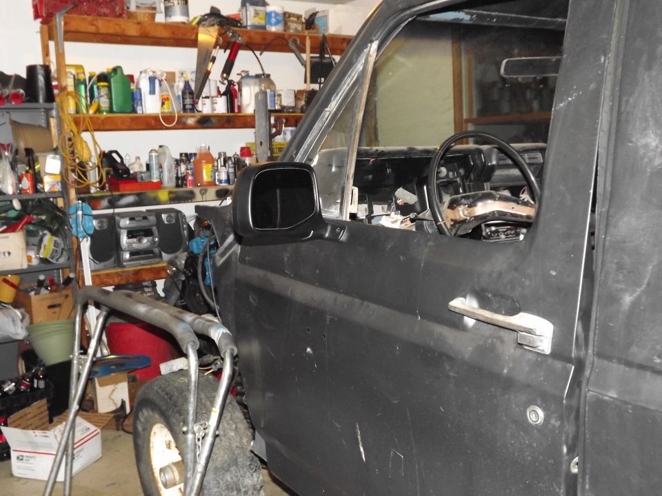 Black 1981 Ford Bronco side view showing door and interior