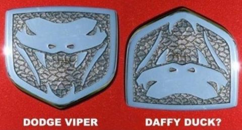1991 Ford Crown Victoria - Two vehicle emblems are shown, one for Dodge Viper and another for DAF.