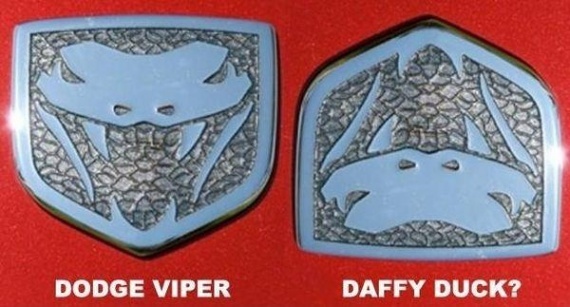 Dodge Viper emblem next to a DAF emblem, both showing snake heads