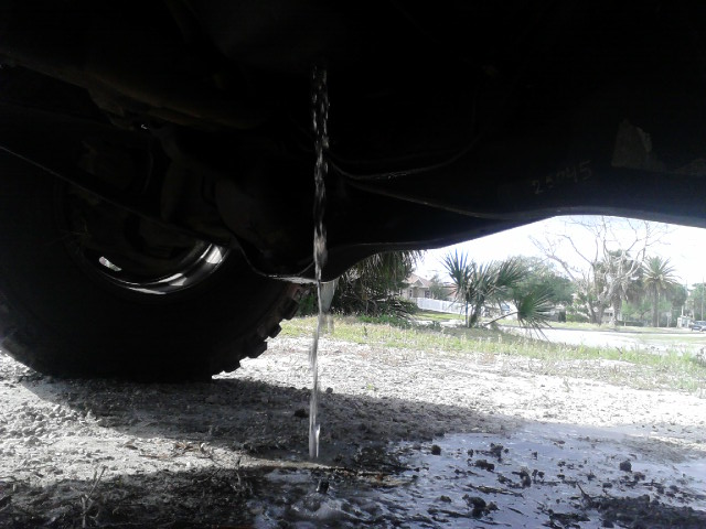 draining the fluids so I can pull my motor. don't think there should be 2 gallons of clean water inside my oil