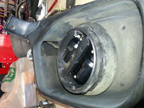 1994 Ford Bronco - Close-up of a vehicle's headlight assembly, revealing its internal structure and wiring.