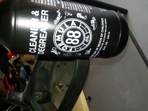 1994 Ford Bronco - A bottle of Formula 88 Cleaner & Degreaser is placed on a car's interior trim, obscuring most of the vehicle.