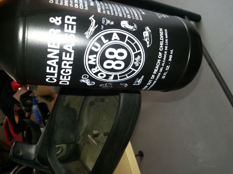Formula 88 Cleaner & Degreaser bottle resting on a car's interior trim piece