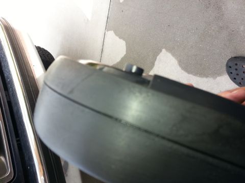 1994 Ford Bronco - A vehicle bumper part is shown in close-up, with a bolt protruding from its surface.