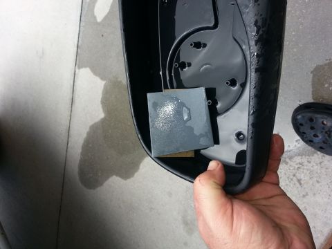 1994 Ford Bronco - Working on a car mirror housing with sandpaper and water.