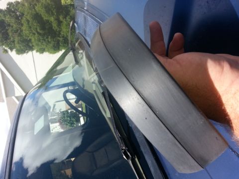 1994 Ford Bronco - Close-up of the windshield trim and wiper blade on a 1994 Ford Bronco.