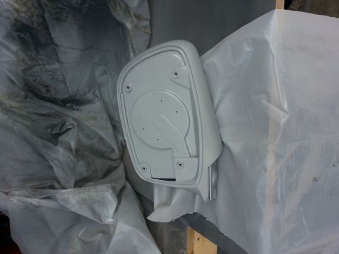 1994 Ford Bronco - A car side mirror is covered in plastic sheeting, likely before being painted or hydrodipped.