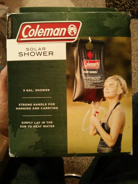 1986 Ford Bronco - Packaging for a Coleman 5-gallon solar shower, designed for camping.