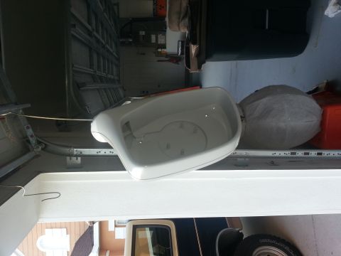 1994 Ford Bronco - A white side mirror is shown, likely for a vehicle, with its mounting points visible.