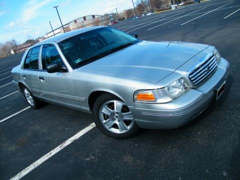 2004 Ford Crown Victoria - This silver 2004 Ford Crown Victoria is shown in a three-quarter front view.