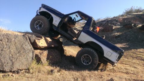 1994 Ford Bronco - 1994 Ford Bronco navigating a rocky off-road course.
