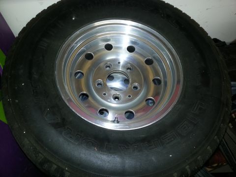 1994 Ford Bronco - Tire and wheel assembly, likely aftermarket or replacement part.