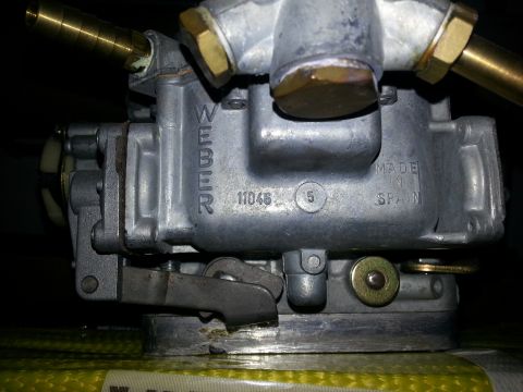 1994 Ford Bronco - This is a close-up view of a Weber carburetor, showing "MADE IN SPAIN" stamped on its casing.