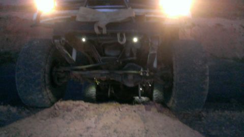 1994 Ford Bronco - The rear of a 1994 Ford Bronco is captured in this image, highlighting its robust tires and suspension system.