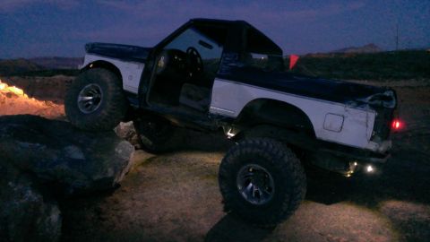 1994 Ford Bronco - This modified 1992 Ford Bronco is navigating rocky terrain at twilight.