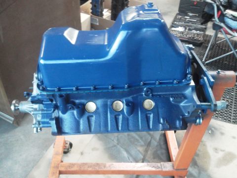 1988 Ford Bronco - Engine block on a stand, with tools in the background.