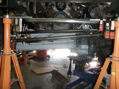 1961 International Scout 800 - Vehicle steering and suspension components are visible while the vehicle is supported by jack stands.
