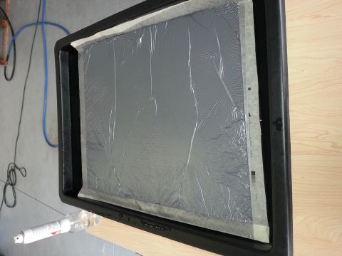 1994 Ford Bronco - A tray prepared for hydrographic application, showing the film and surrounding tools.