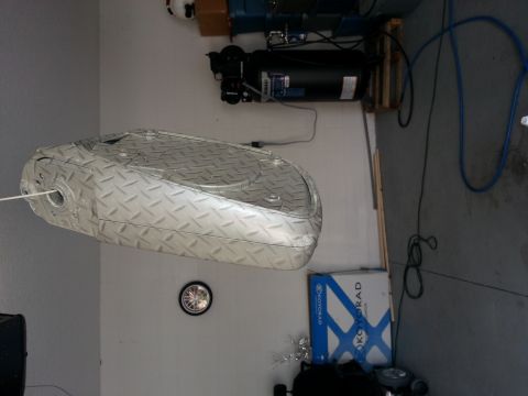 1994 Ford Bronco - Diamond plate fuel tank with a white line extending from a hole on its side.