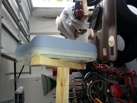 1994 Ford Bronco - Car parts are prepped for painting in a garage setting with bicycles in the background.