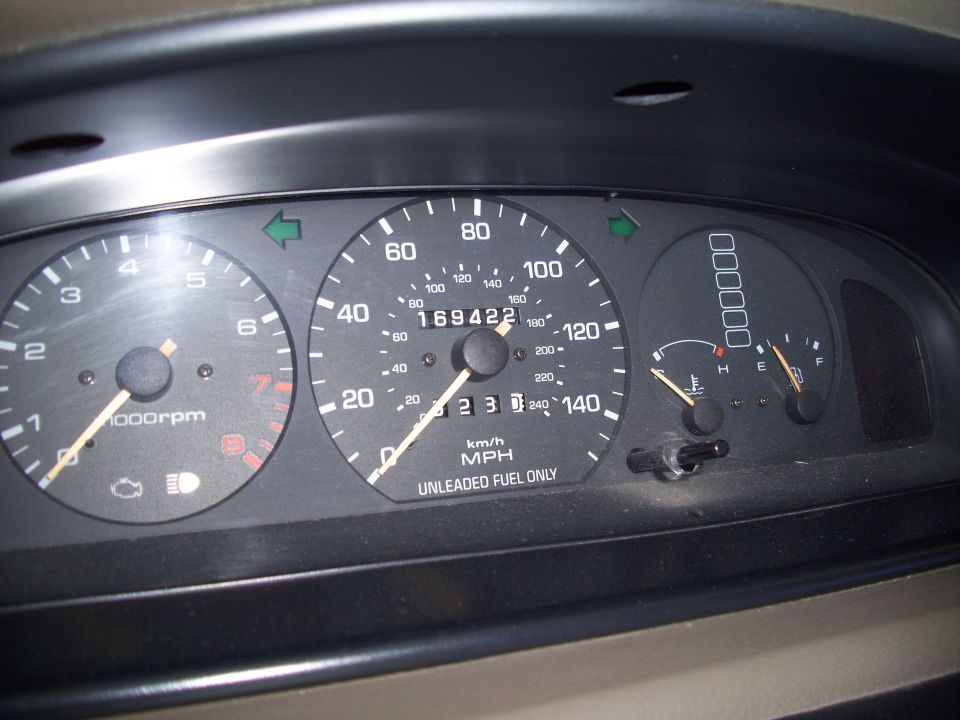 1993 Ford Probe dashboard with speedometer, tachometer, fuel gauge, and temperature gauge visible