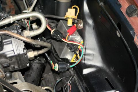 1980 Ford Mustang - A complex network of wires and connectors are visible in the engine compartment.