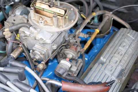 1980 Ford Mustang - Engine components are visible, including a carburetor and a valve cover that reads "COBRA POWERED BY".