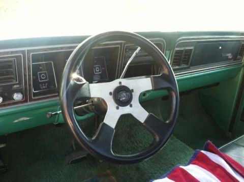 1977 Ford F-350 - Interior view of a 1977 Ford F-350 with an aftermarket steering wheel.