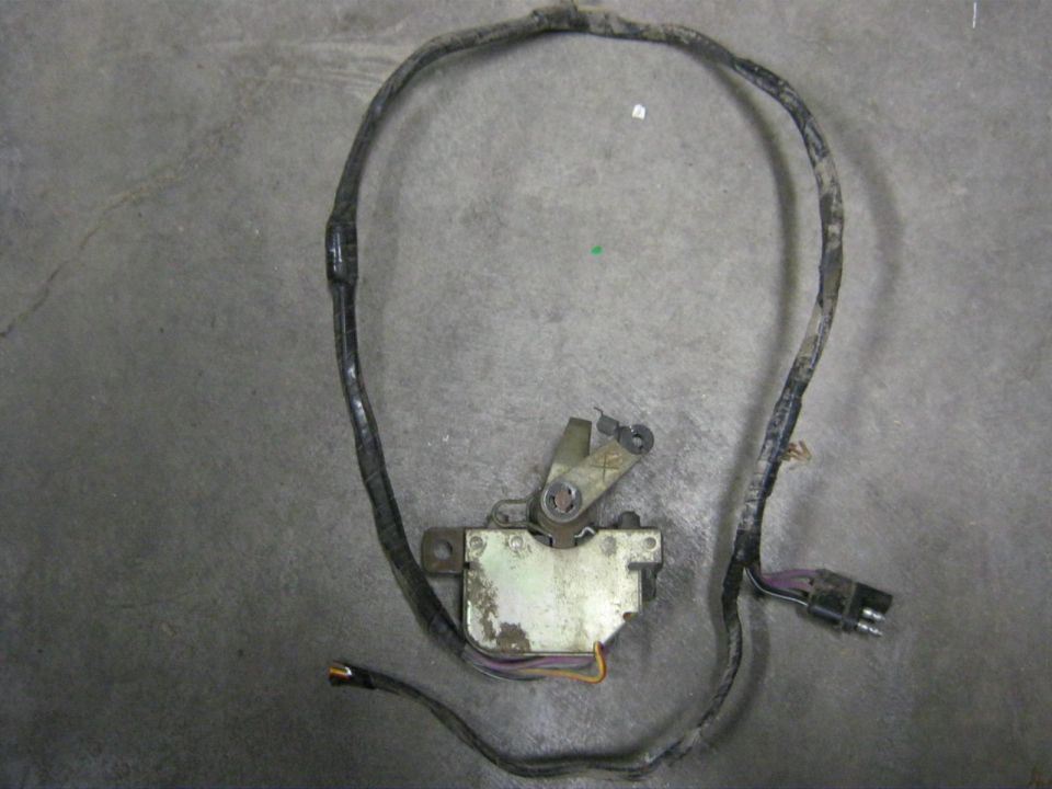 Automotive electrical actuator with a black wiring harness and a multi-pin connector