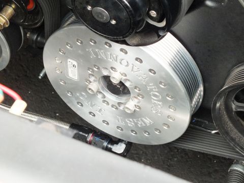 2003 Ford Crown Victoria - Polished Innovators West crank pulley with the company name machined into the face, surrounded by serpentine belt drive