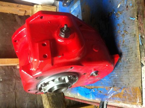 1989 Ford Bronco - Close-up of a red transfer case part, possibly for an older 4x4 vehicle.