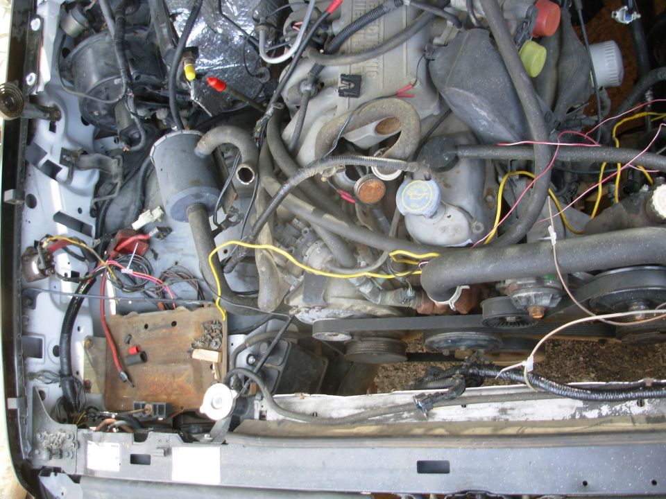The yellow wire is temporary power from the aux. battery cable to the frame harness for the t/g window.