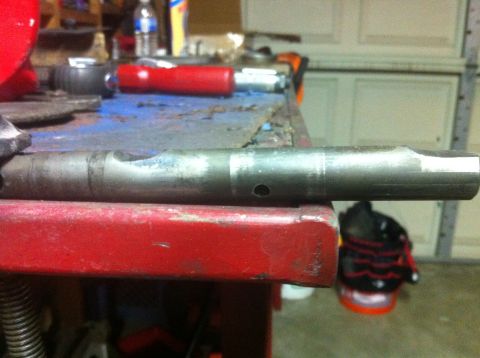 1989 Ford Bronco - A metal shaft with a hole and a notch is shown in detail.
