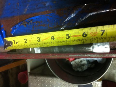 1989 Ford Bronco - A yellow measuring tape is used to measure a metal rod, indicating its length is approximately 7 inches.