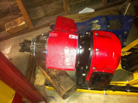 1989 Ford Bronco - This is a transfer case assembly, likely for a 4x4 vehicle, painted red and black.