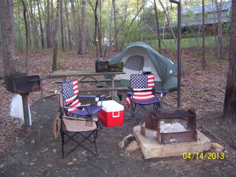 1990 Ford Bronco - Campsite scene with picnic table, tent, chairs, and grills. Photo dated 04/14/2013.