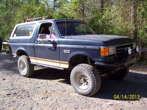 1990 Ford Bronco - This Ford Bronco is parked on a gravel road with trees in the background. The date 04/14/2013 is visible.