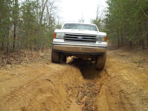 1990 Ford Bronco - This 1990 Ford Bronco navigates a challenging off-road path.