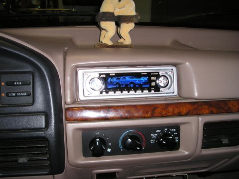 1996 Ford Bronco - The dashboard features an aftermarket JVC stereo and controls for 4x4 and climate settings.