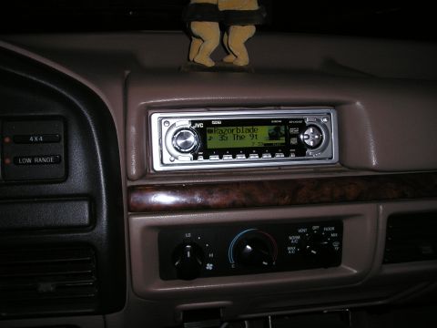 1996 Ford Bronco - The interior of a vehicle displays a JVC CD player and climate controls, with a 4x4 selector nearby.