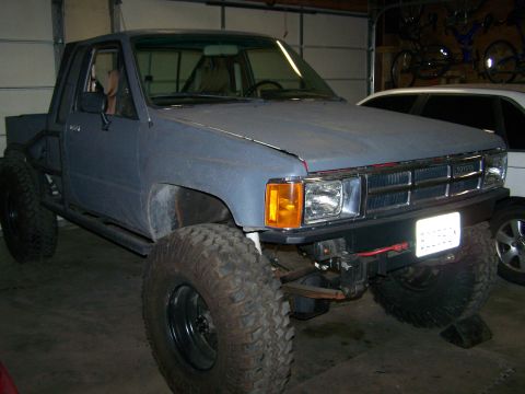 1988 Suzuki Samurai - This heavily modified Toyota pickup truck features oversized tires and a custom roll cage.