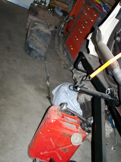 1988 Suzuki Samurai - Fuel tank and red gas can are visible in a garage setting.