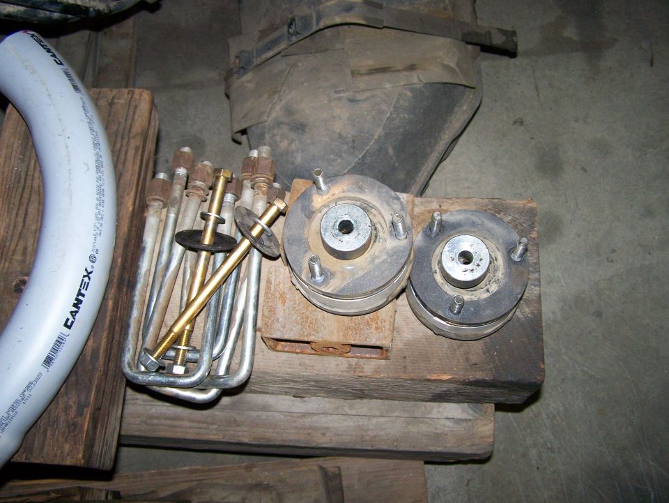Suspension parts including coil springs and shock mounts