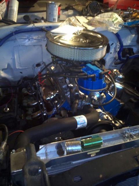 1973 Ford Ranchero - Engine bay detail showing a V8 engine with aftermarket parts installed.