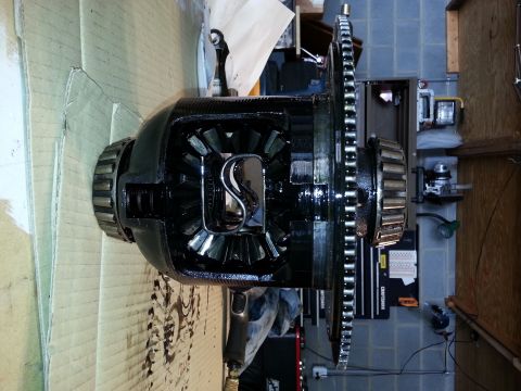 1995 Ford Bronco - Differential assembly with visible gears and a chain drive mechanism, likely for a vehicle drivetrain.